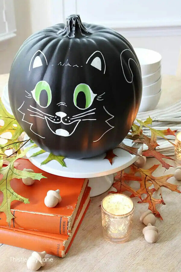 Black pumpkin with green eyes