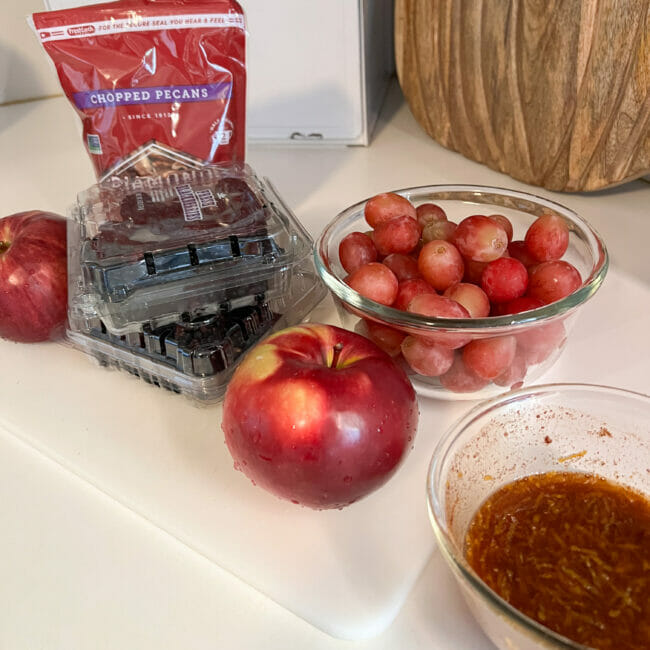 apples, grapes, blackberries in bowls