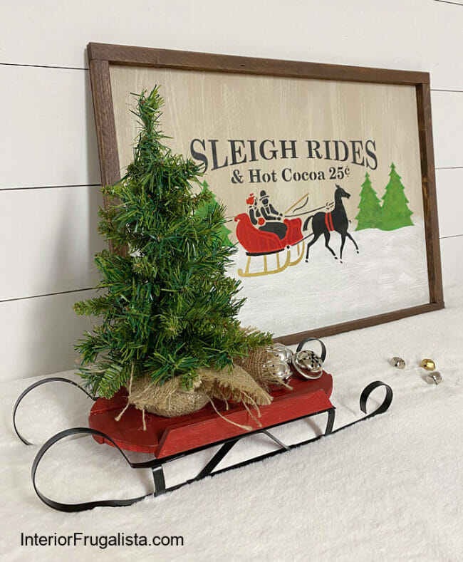sleigh art with sleigh and tiny tree inside