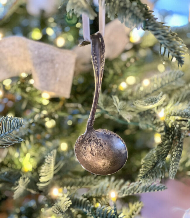 vintage silver ladle hanging on tree