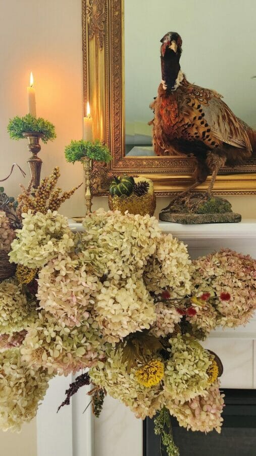 dried hydrangeas and candles on mantel