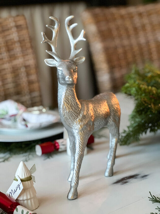 silver deer statue on table