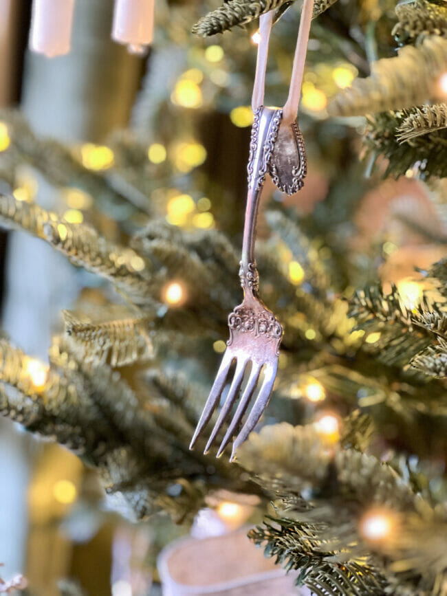 vintage ornate silver fork hanging on Christmas tree