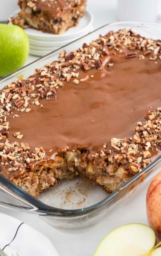 apple cake with caramel and nuts in glass pan