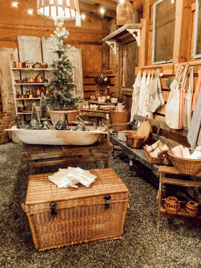 room with vintage basket, shelves, dough bowl, seating, etc.