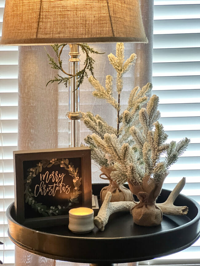 round table with lamp, trees and Merry Christmas sign
