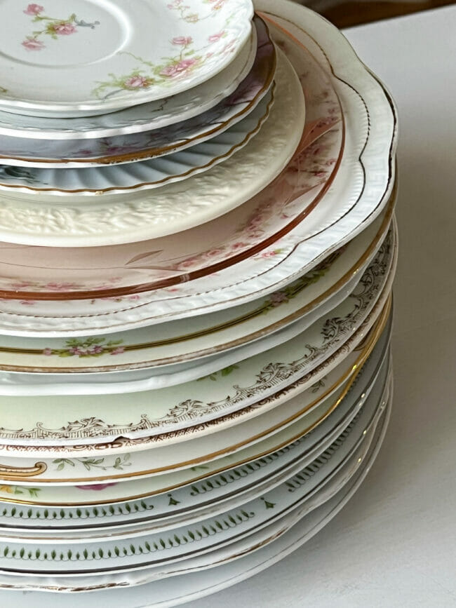 close up of stacked vintage plates