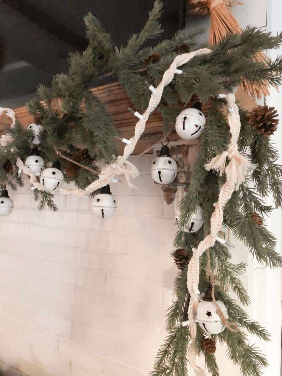 cream macramé covered twinkle lights with white bells 
