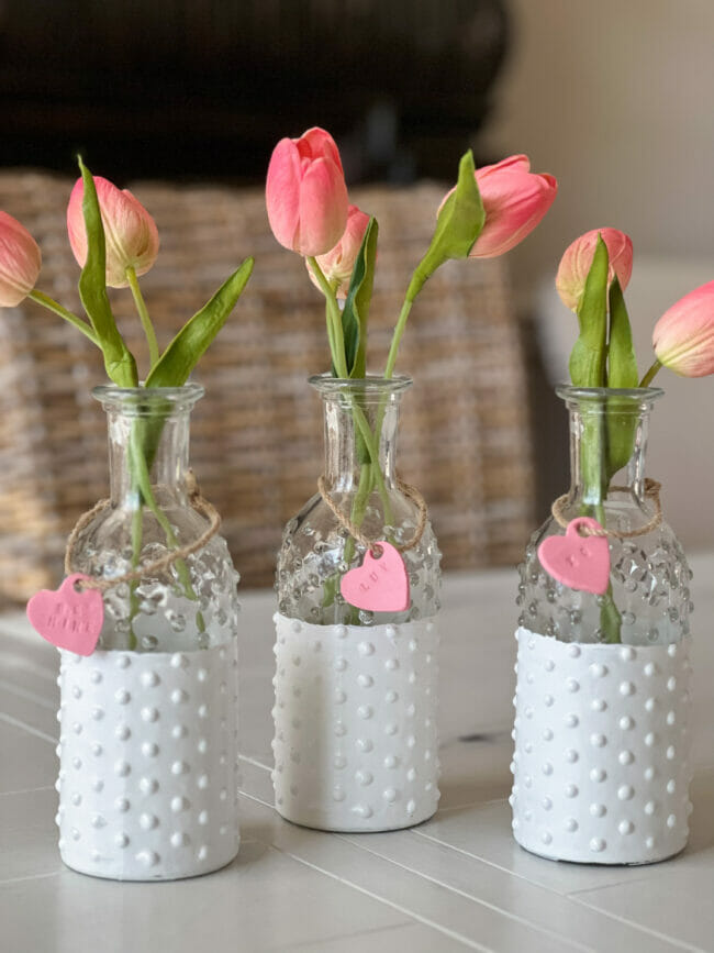 3 white dipped glass knobby vases with pink tulips and pink hearts 