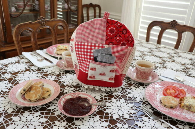 red and white tea cozy on a valentine table