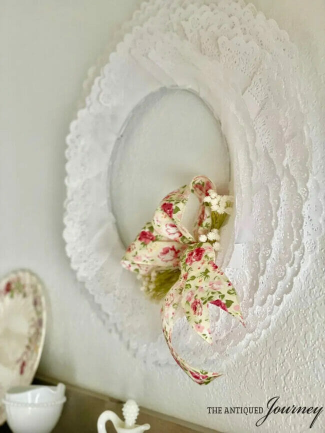 white doily wreath with floral bow