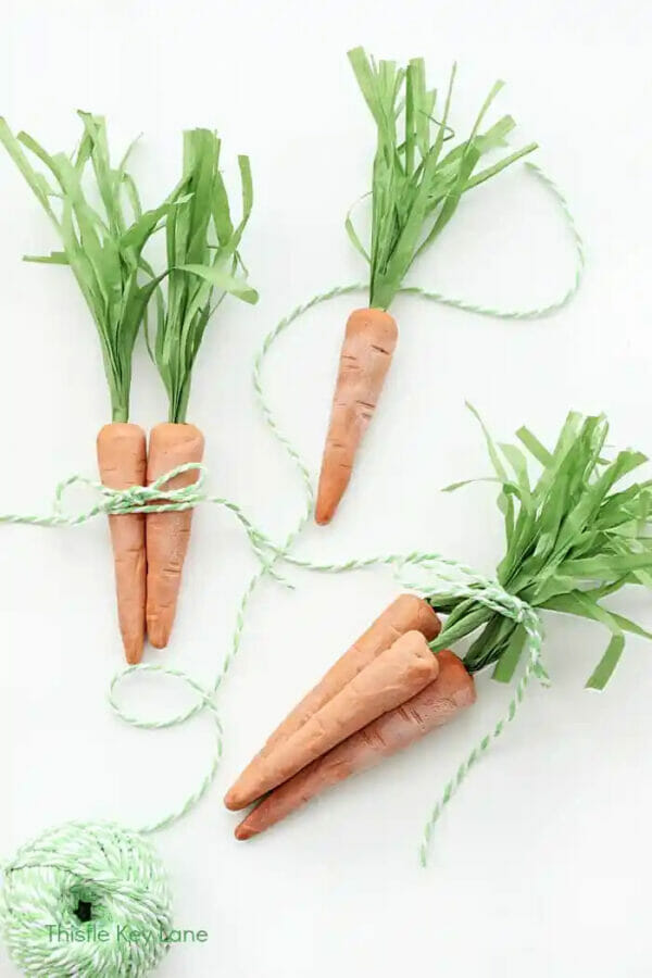 orange clay carrots with green and white string