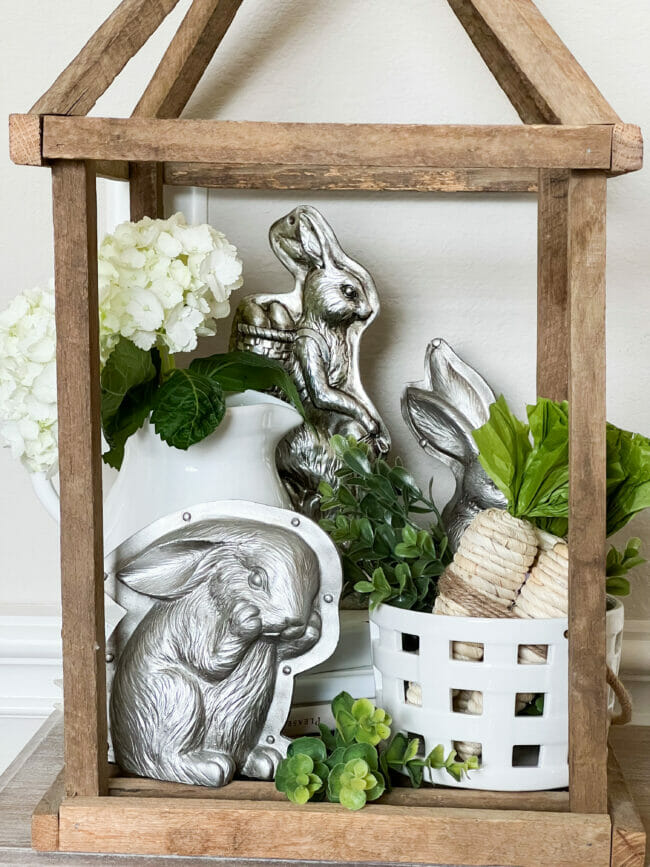 silver bunnies, white pitcher with flowers and carrots