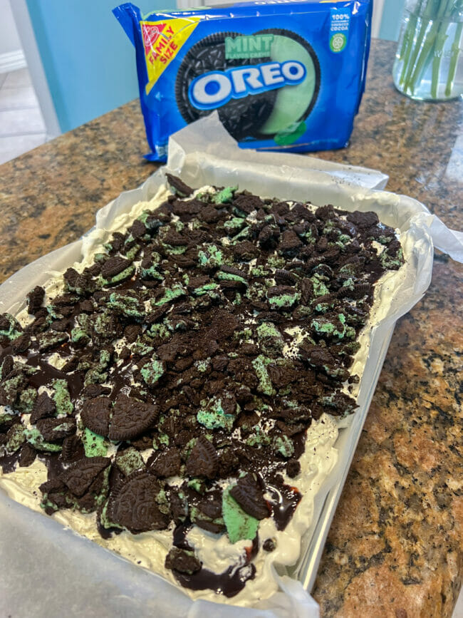crushed Oreos on top of ice cream cake