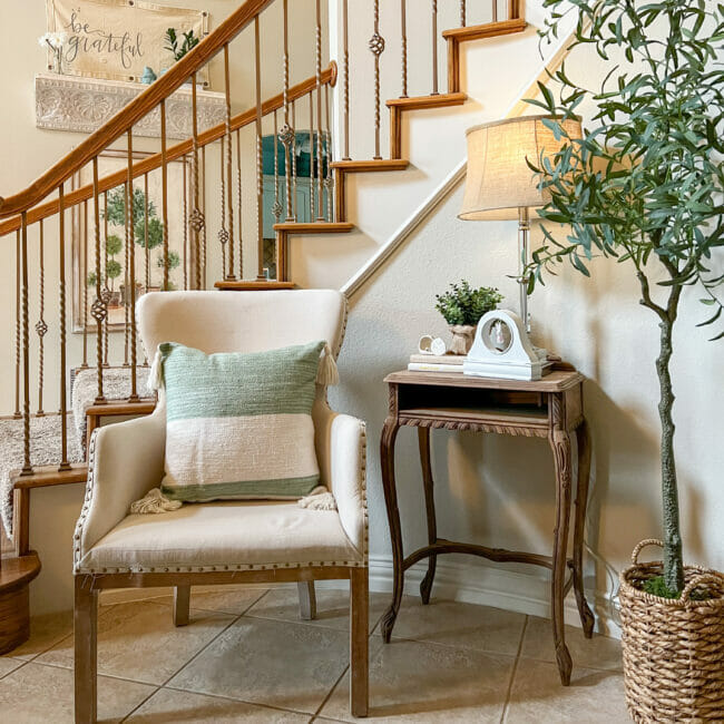 stairs with chair, pillow, table and tree