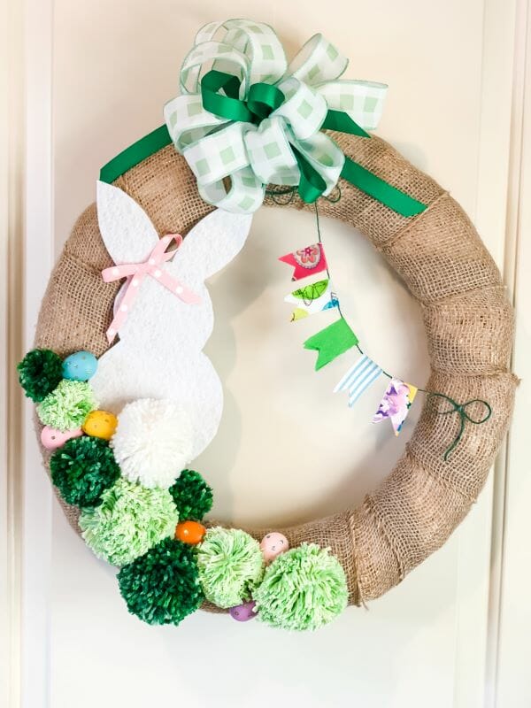 burlap wreath with green pompoms and white bunny