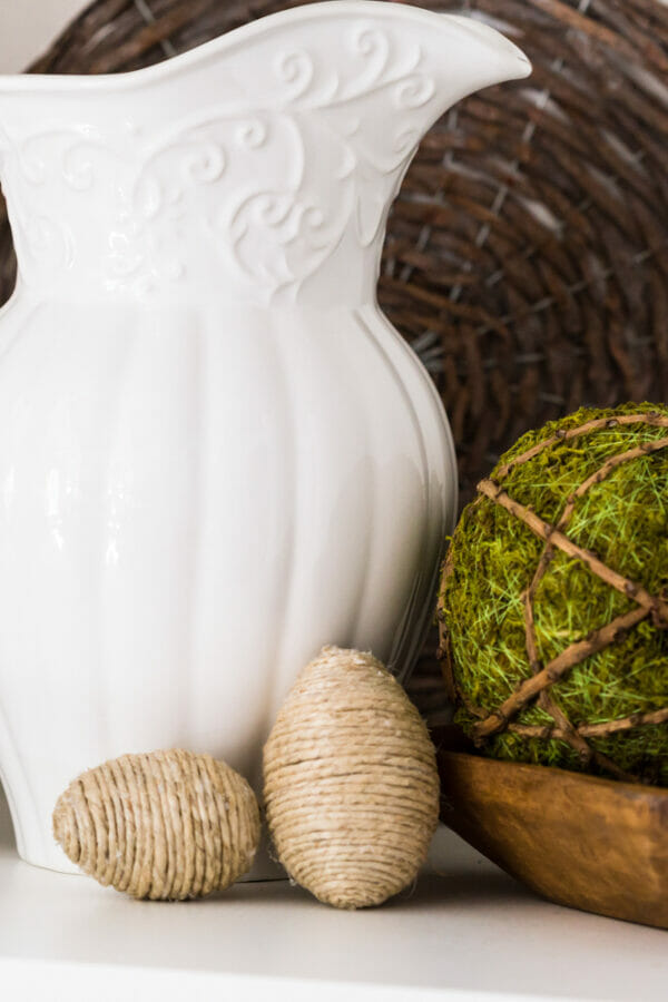 white pitcher, moss ball and twine eggs