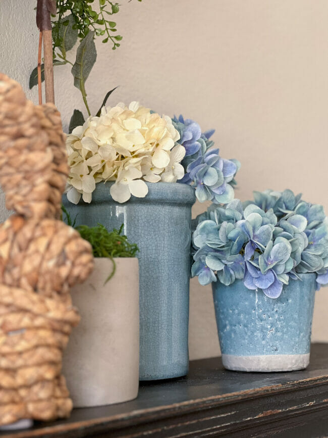 close up of blue crocks with hydrangeas 