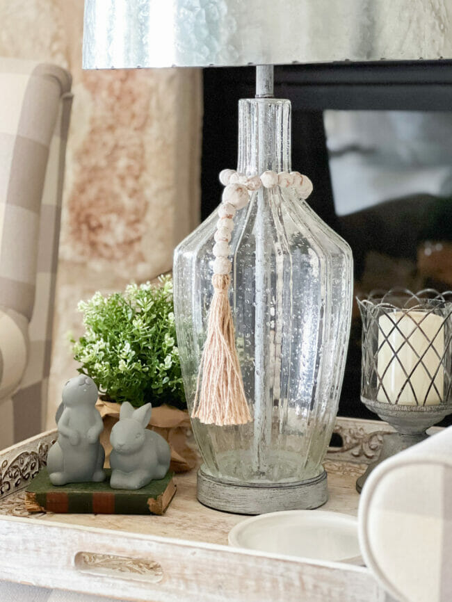 glass lamp with gray bunnies and candle