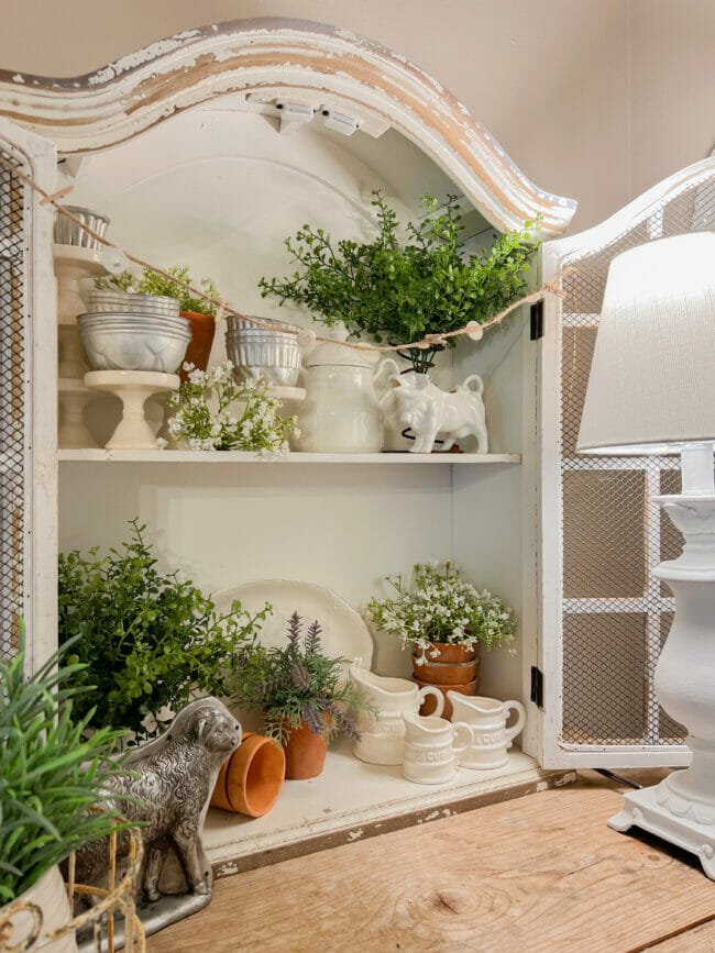 cabinet with gardening theme and lamp