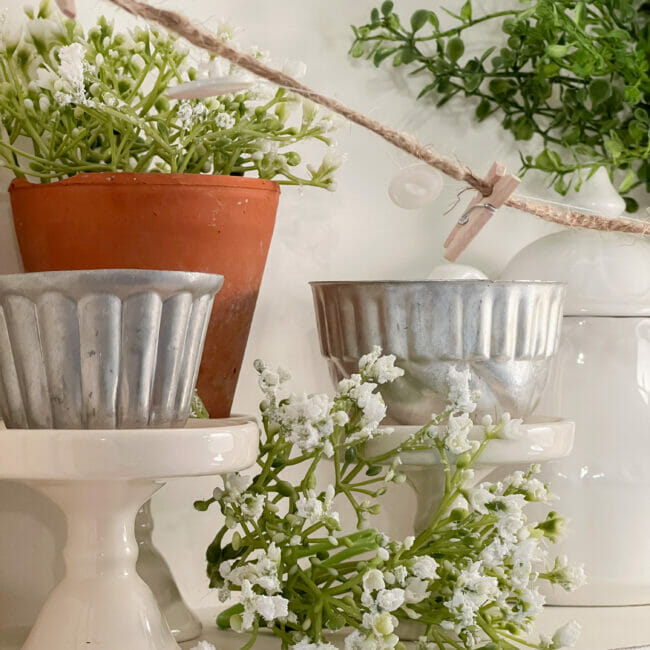 https://www.countyroad407.com/wp-content/uploads/2023/05/Vintage-molds-with-faux-babys-breath.jpg