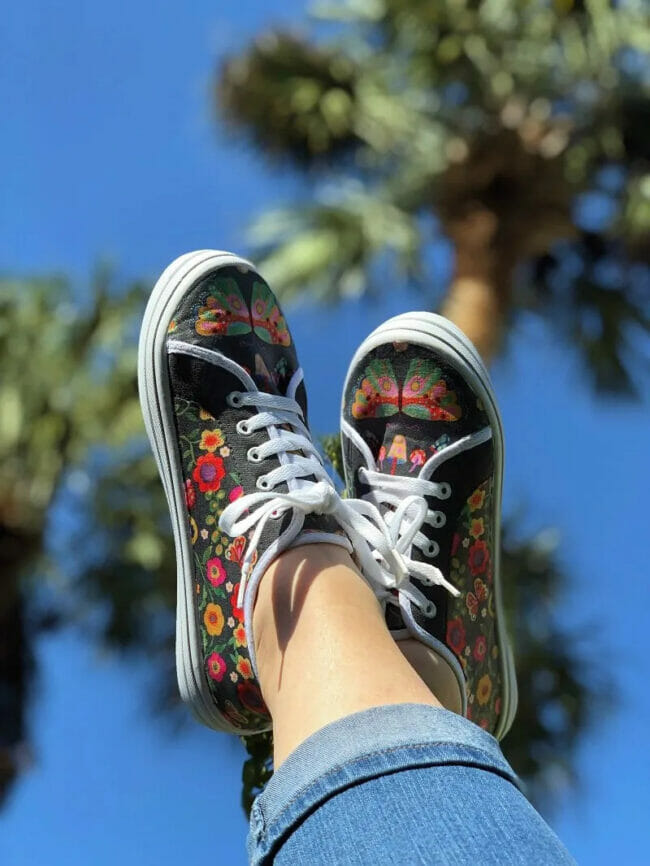 black sneakers with flowers