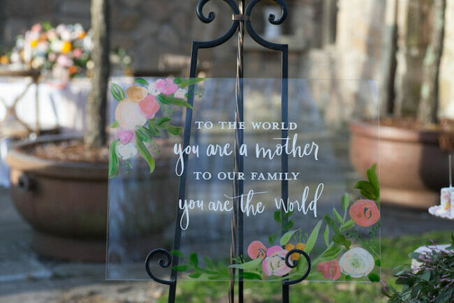 black easel with glass Mother's Day poem painted on