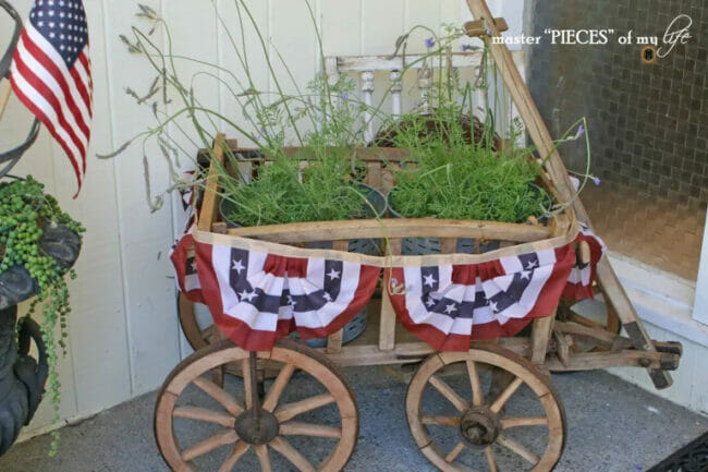 SMALL WAGON WITH PLANTS AND PATRIOTIC BUNTING
