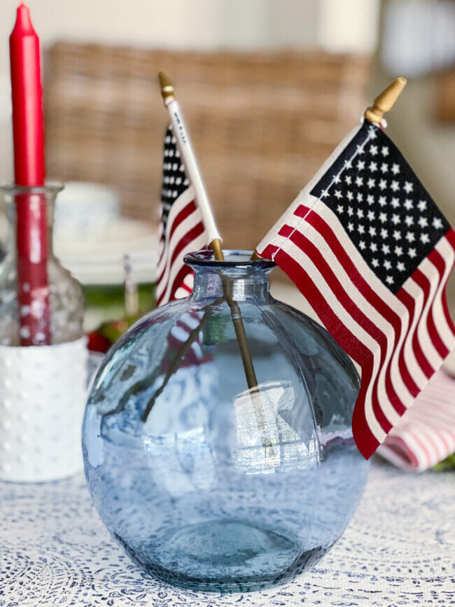 blue glass jar with flags