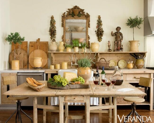 wood table and wood shelves with breadboards and mirror in a kitchen