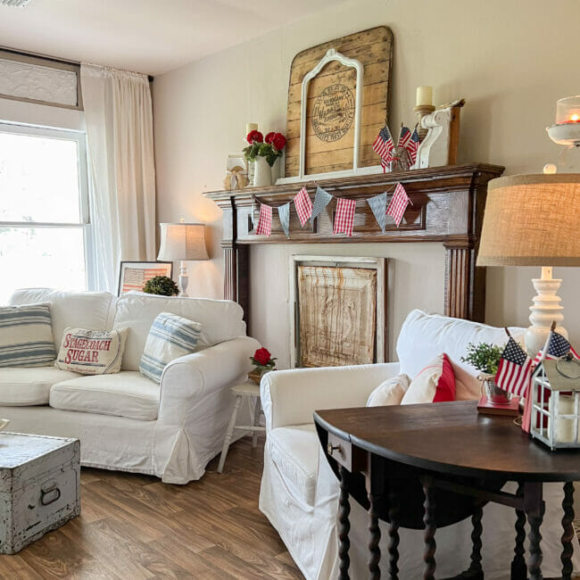 white seating with patriotic mantel and side tables