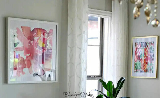 bright prints on wall with window