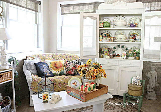 sun room with vintage dishes and sunflowers