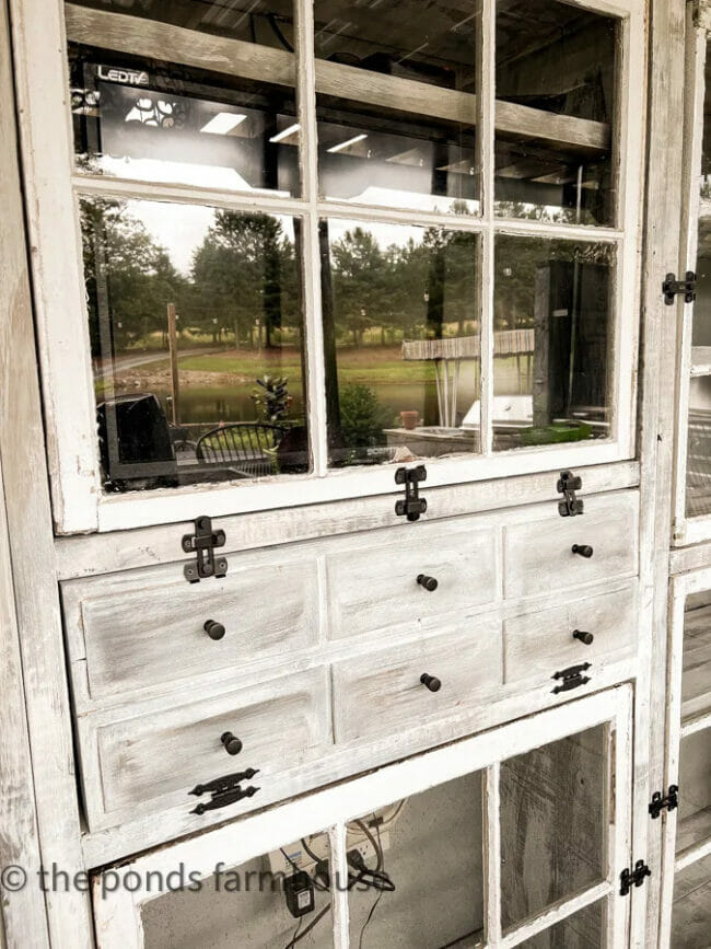 white cabinet with salvaged windows