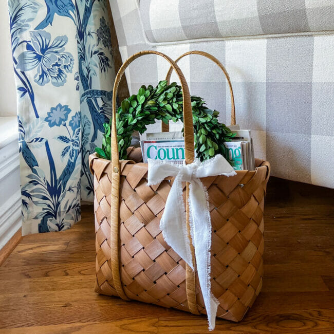 magazine basket with bow and boxwood wreath