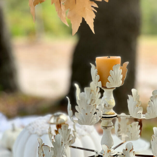 close up of vintage candelabra with gold votive on top