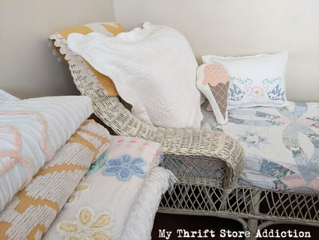 vintage quilts on table and chaise 