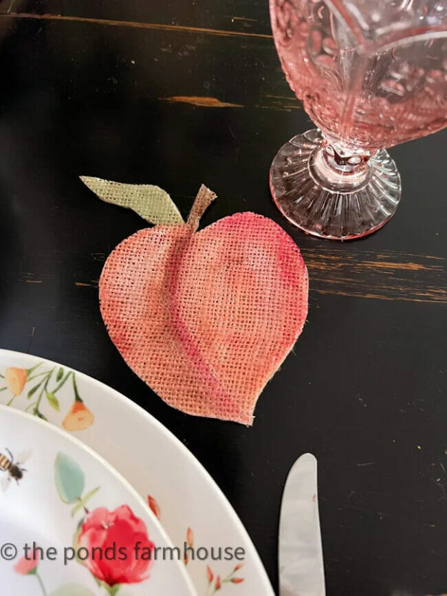 painted peach coaster with pink goblet