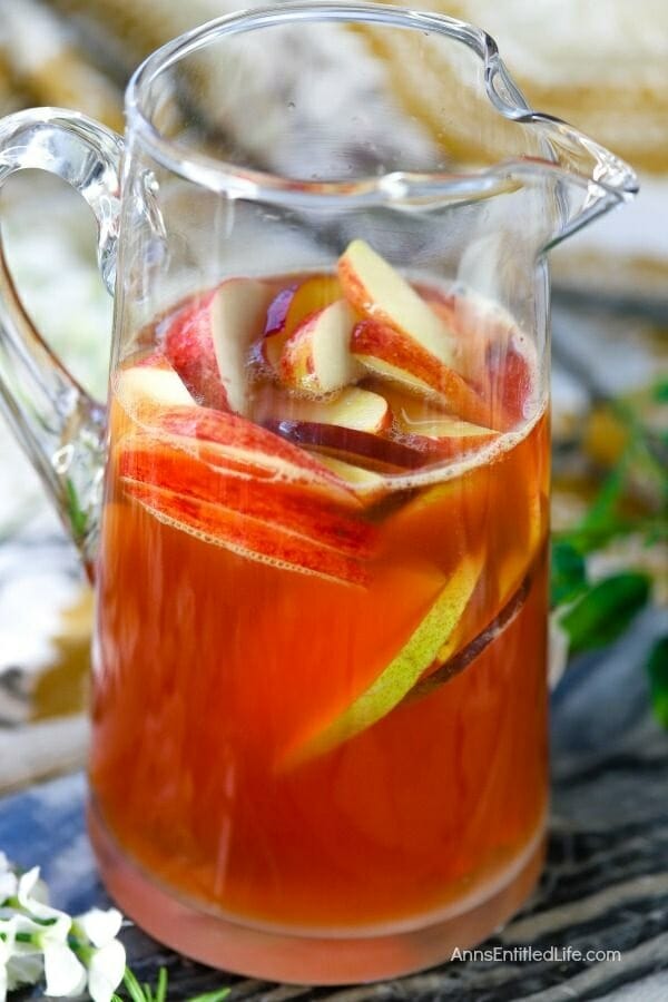 pitcher of fall punch with apples