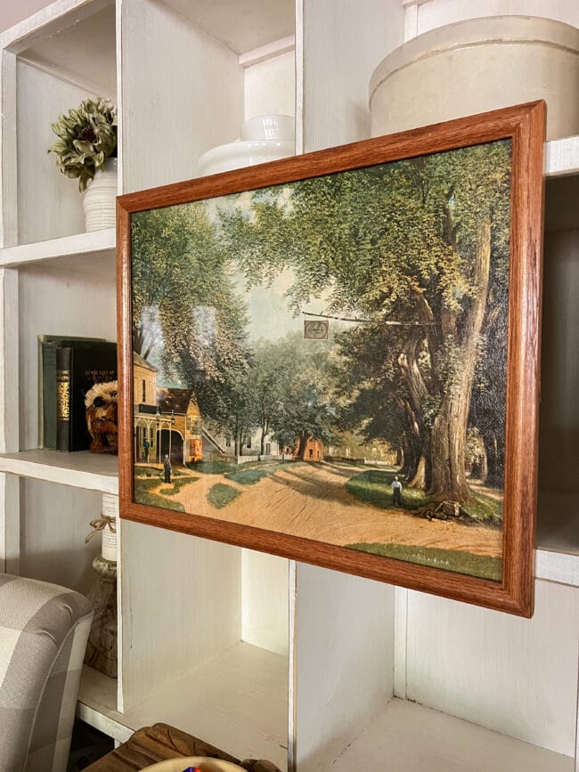 old town landscape painting in wooden frame