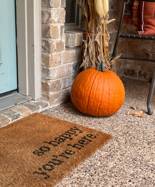 door mat and pumpkin