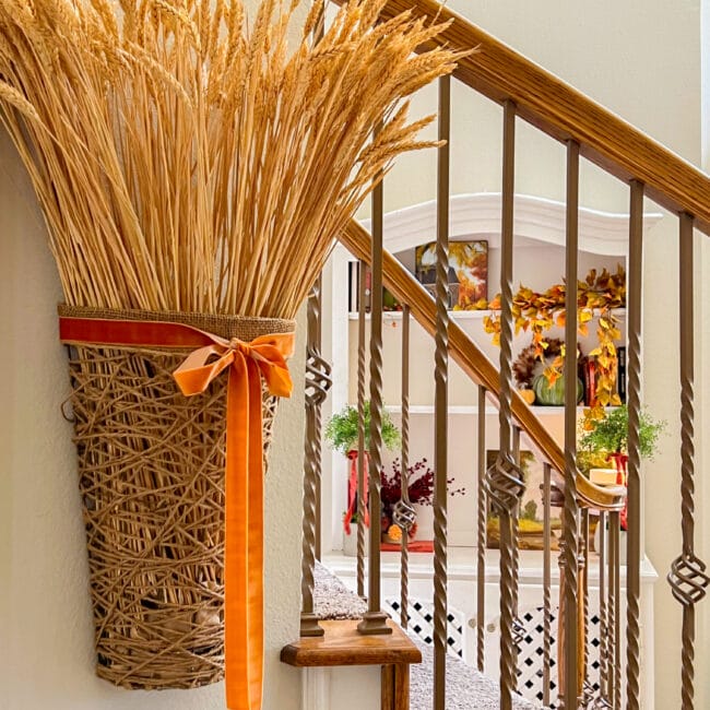 wall basket with wheat, hanging by stairs