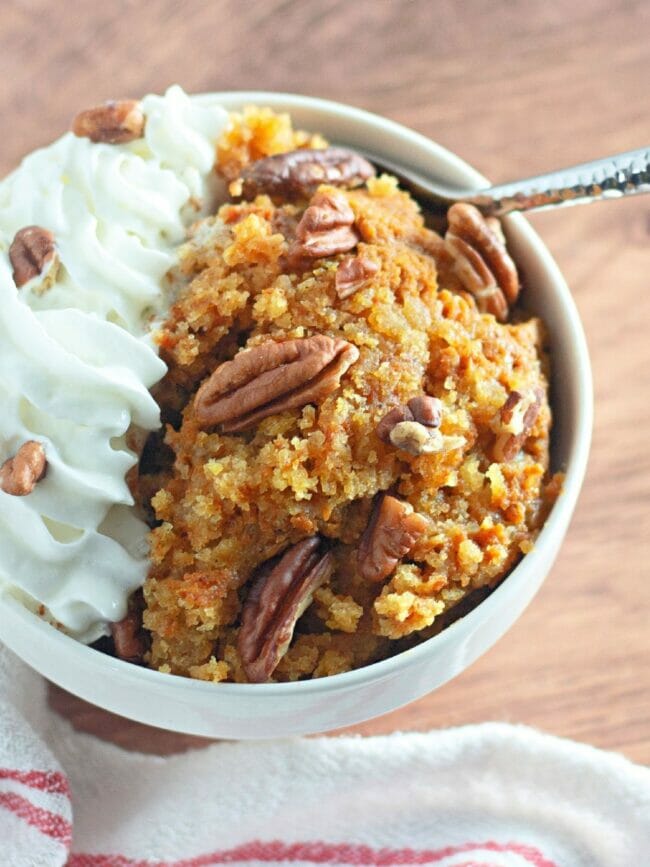 pumpkin pecans and cream in a white bowl