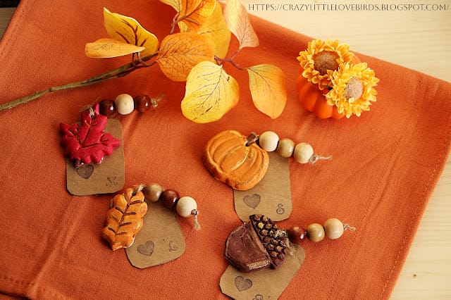 orange cloth with fall place cards with beads