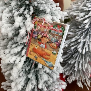 vintage story book in front of flocked limbs