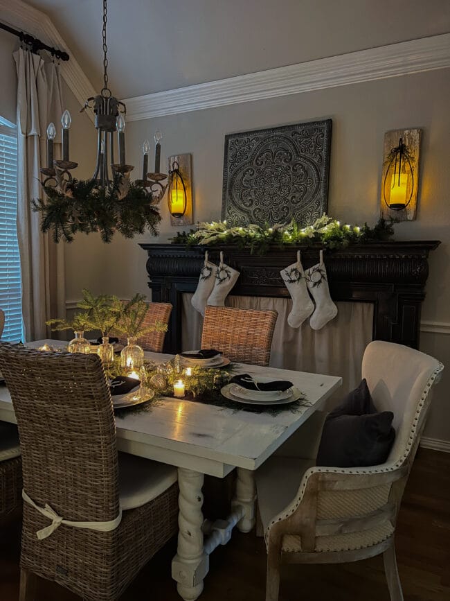 full dining room with table, chairs, mantel with stockings and Christmas decor