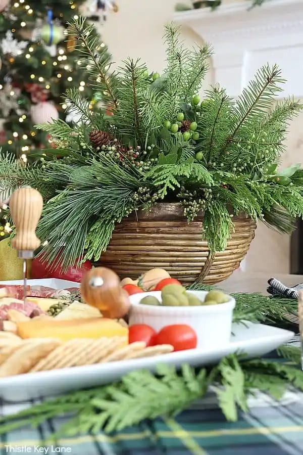 fresh greenery in bowl with charcuterie board