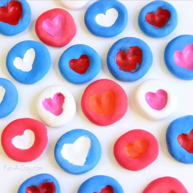blue, red and pink thumbprint heart s inside clay circles