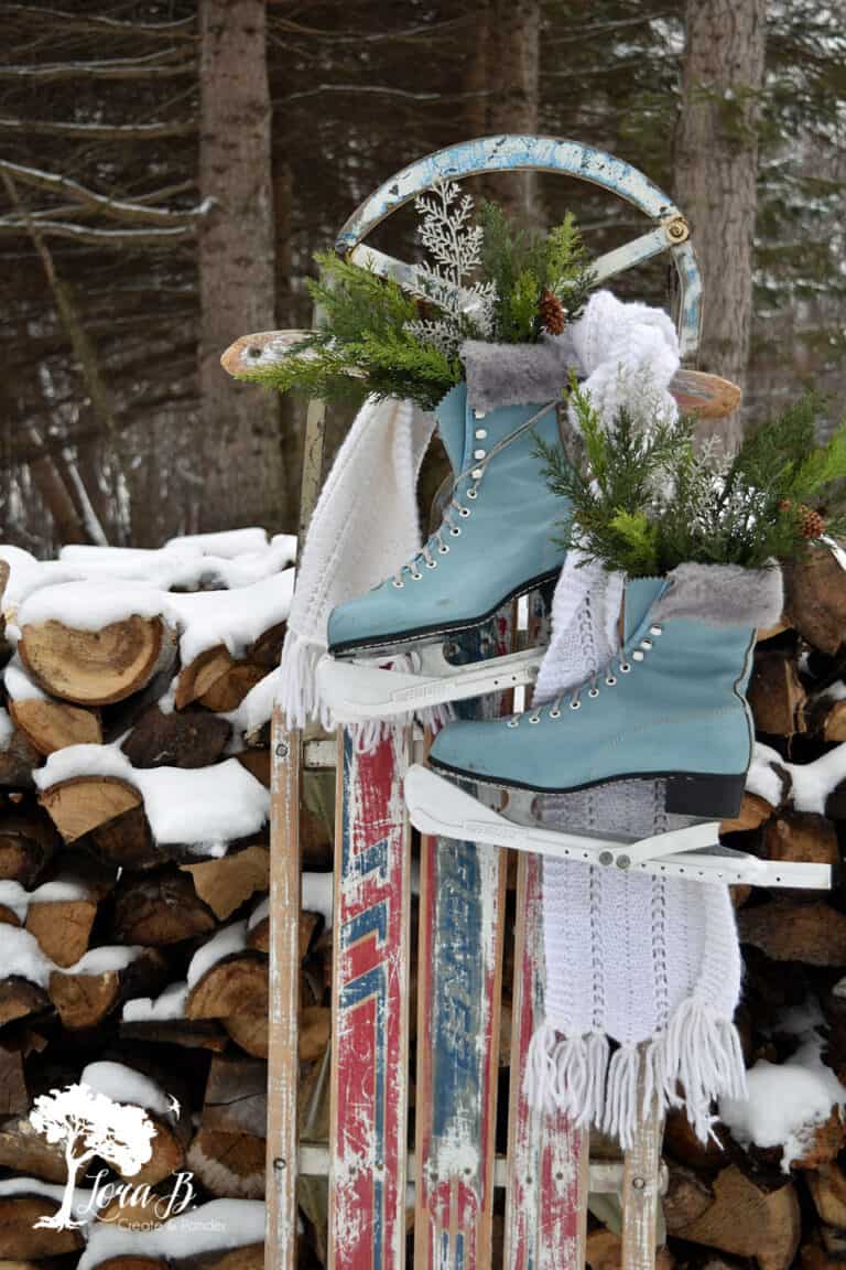 sled with light blue ice skates and snow