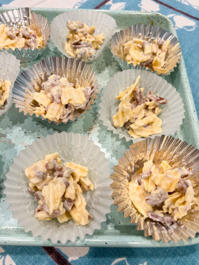 cupcake liners with potato chip, chocolate and pecan snack